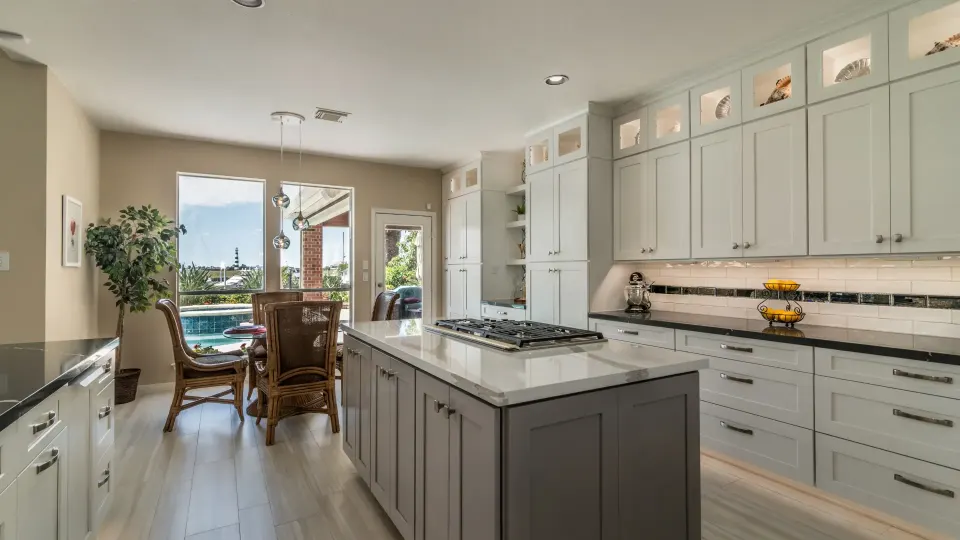 Remodeled kitchen with island and new cabinetry