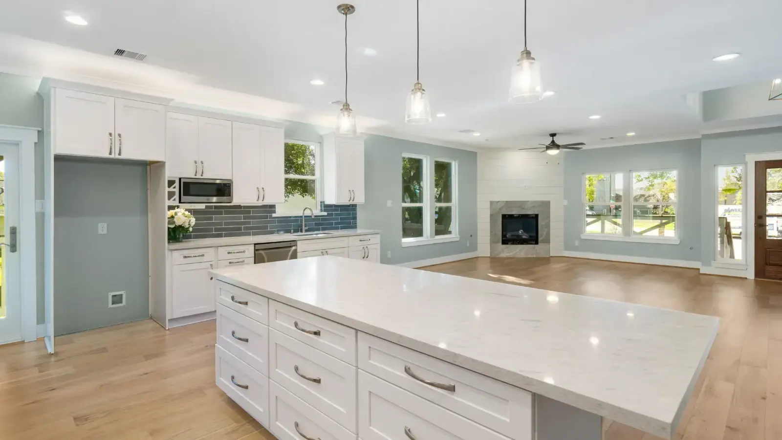 Remodeled kitchen with island and pendant lighting